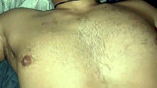 Two hung dudes banging hard on a bed in hot gay action.