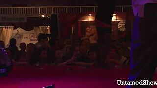 Watch this naughty brunette dance and rip off her clothes?