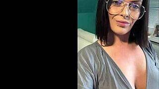 A mature beauty with short hair in a solo femdom scene.