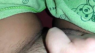 i was masturbating under the covers while my classmate searched for a book, leading to her orgasm