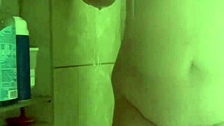 She washes her pussy in the shower, showing off her big tits and ass