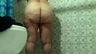 Hidden camera in shower spying on mature stepmother