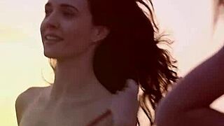 Four lesbian brides and their friends enjoy each other on the beach.