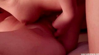 Lesbian friends kiss passionately, strapon fucking their pussies