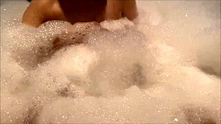 A perverted Japanese couple enjoys sex in the bubble bath, getting wild and wet
