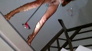 Brunette with small waist rides black dildo up her dress without panties in hotel corridors.