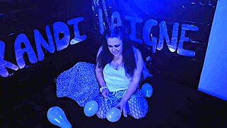 Beautiful brunette MILF Kandi Laigne has a balloon popping fetish