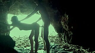 Amateur couple’s intimate moment in a secluded cave at the beach