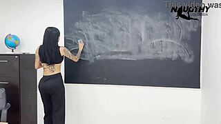 Beautiful teacher masturbates with dildo in classroom
