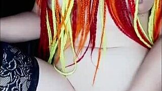 With a lover via video call, she masturbates solo