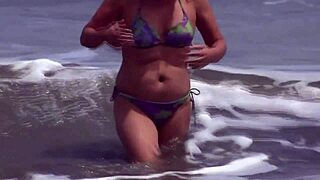 Mature Latina beauty flaunts her assets on the beach