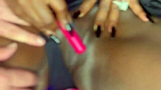 Sexy black model uses vibrator on her tight shaved pussy for white guy