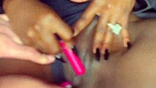 Sexy black model uses vibrator on her tight shaved pussy for white guy