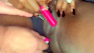 Sexy black model uses vibrator on her tight shaved pussy for white guy