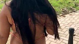 Long-haired brunette wife shows off her body in bikini