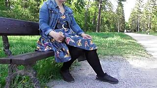 Cross dressing wife showing off her hairy beaver in a public park