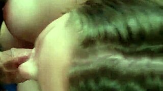 A wife gives a blowjob to her friend in her home