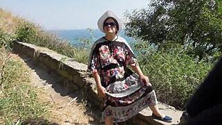 Public display of a mature woman in a transparent dress