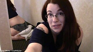 A slightly overweight woman in denim shorts has sex on the bed and reaches an orgasm