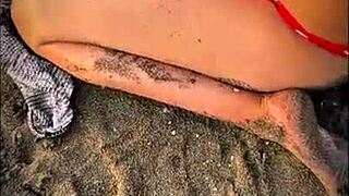 Petite brunette gets a big cock on the beach