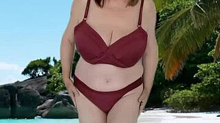A mature woman with large breasts wears a bikini and suggests herself