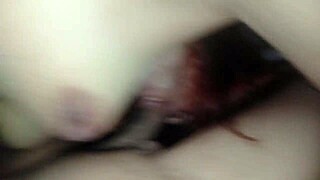 Close up of a pussy fucking with a strapon and dildo on the clitoris