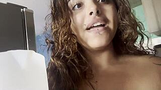 Naked curvy beauty sipping coffee and chatting with camera