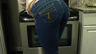 Beautiful wife with large breasts in the kitchen in a hot scene
