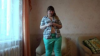 The girl plays with her big boobs and wet pussy