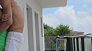 Young man seduces beautiful girl on the balcony