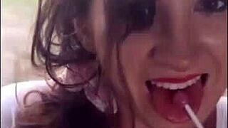 Cute girl plays with lollipop on train ride