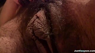 busty babe fingers her hairy bush in a steamy bathroom solo session