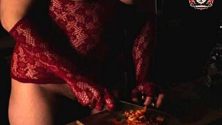 The girl is cooking without any clothes on