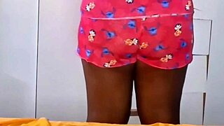 Applying cream on my feet while showing my cunt
