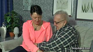 Passionate sex of elderly German couple on the sofa