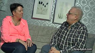 Passionate sex of elderly German couple on the sofa