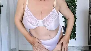 Busty granny in sexy lingerie makes a delightful dance