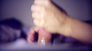 During a sensual massage, she gives an intense handjob leading to a messy cumshot.