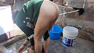 Indian Wife Bathes Outdoors in Public Bath, Revealing Wet Allure