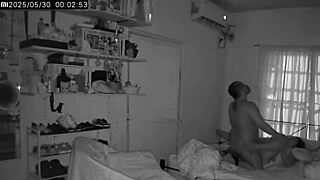 spying on an amateur couple having some steamy fun in their private space.