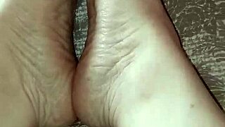 gretala rubs her thong on her bare feet