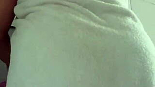 madura takes a relaxing shower in the bathroom with casual everyday routine.