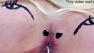 Check out this huge tattooed ass spreading with anal toys in sheer red