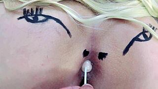 Check out this huge tattooed ass spreading with anal toys in sheer red