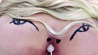 Check out this huge tattooed ass spreading with anal toys in sheer red