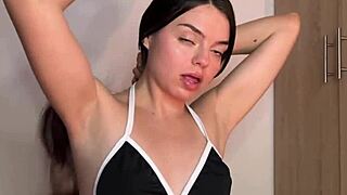 Beautiful Colombian teen fingers her wet pussy in the dorm.