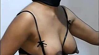 This skinny black girl is sucking milk from a huge dick