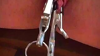 Big pink pussy lips dangled and stretched down with weights.