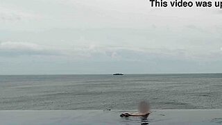 relaxing by the infinity pool