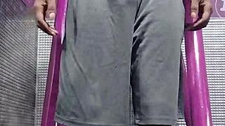 Black Brunette Uses Fitness Machine for Intense Gym Workout